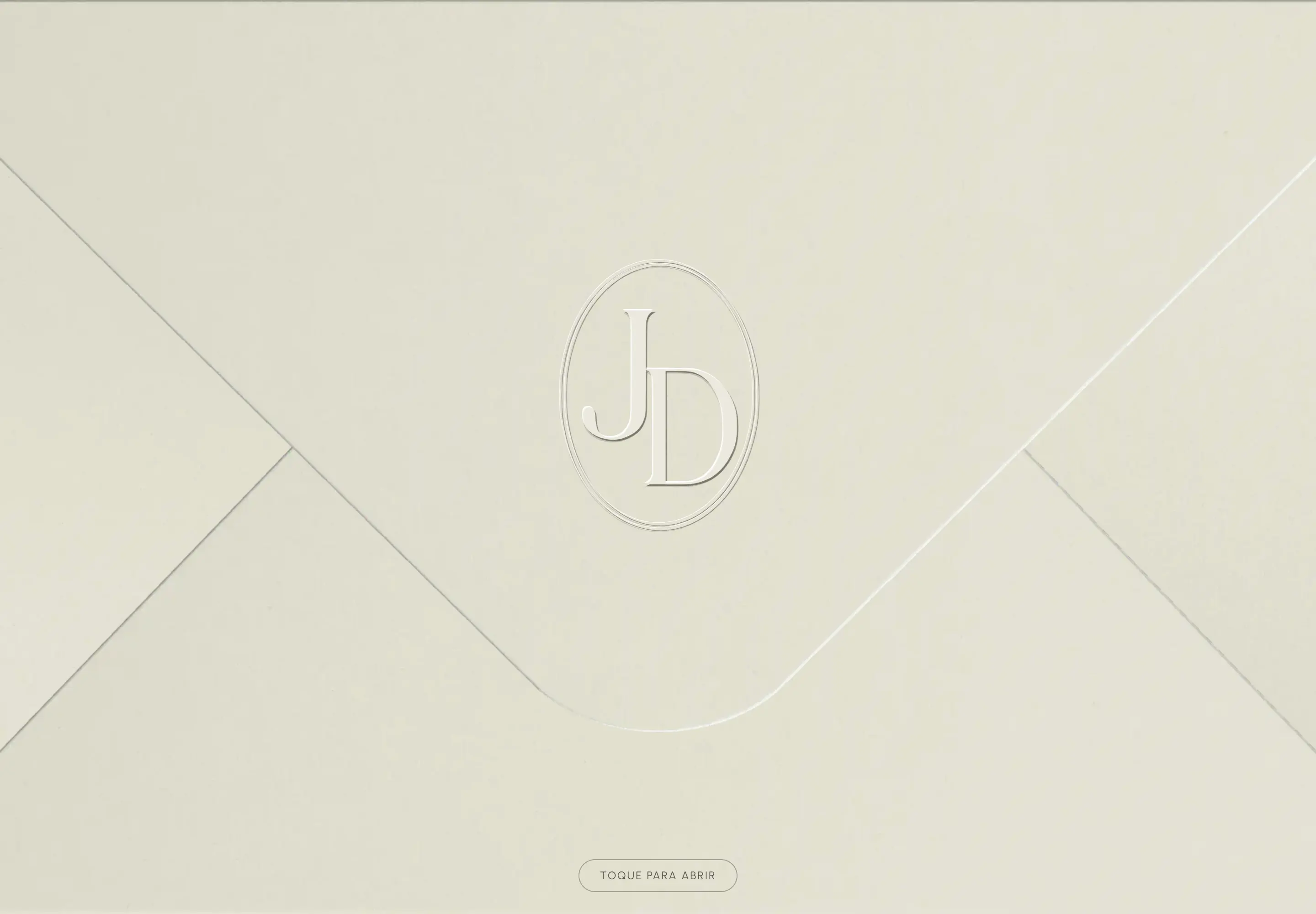 Closed light paper envelope with an embossed JD monogram and a “Tap to open” button